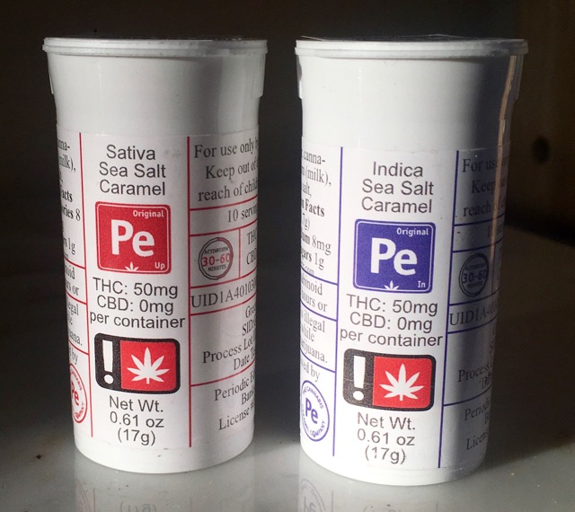 Two containers of Periodic Sea Salt Caramels in Indica and Sativa. Packaging showing total of 50mg THC per package.